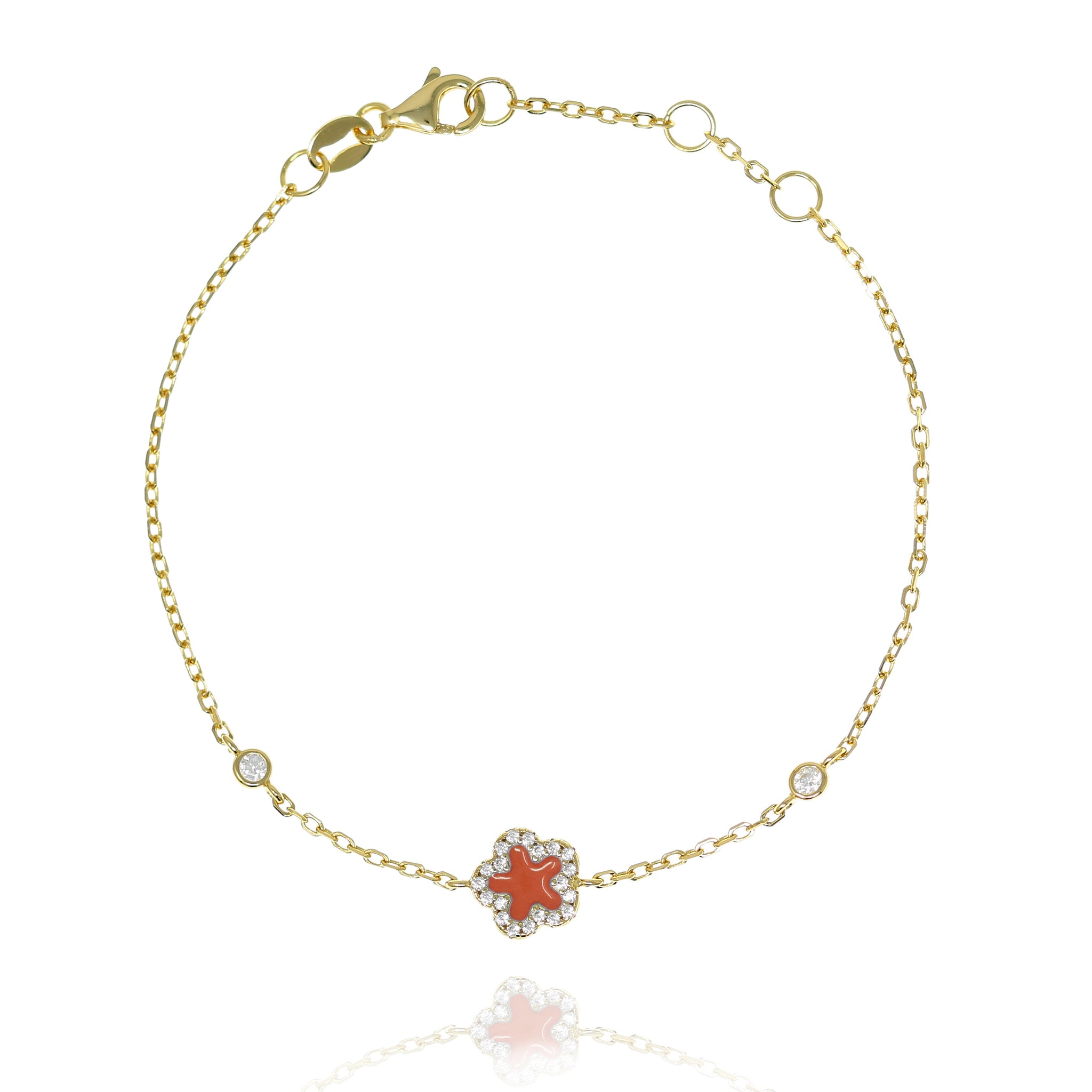 
Gold-plated chain bracelet with cubed zirconia-rimmed red star and secure lobster clasp.

