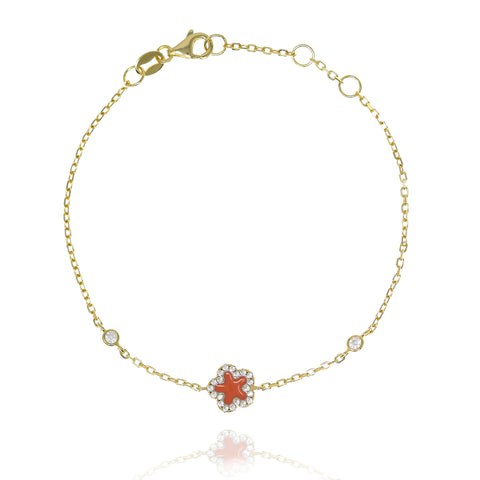 
Gold-plated chain bracelet with cubed zirconia-rimmed red star and secure lobster clasp.

