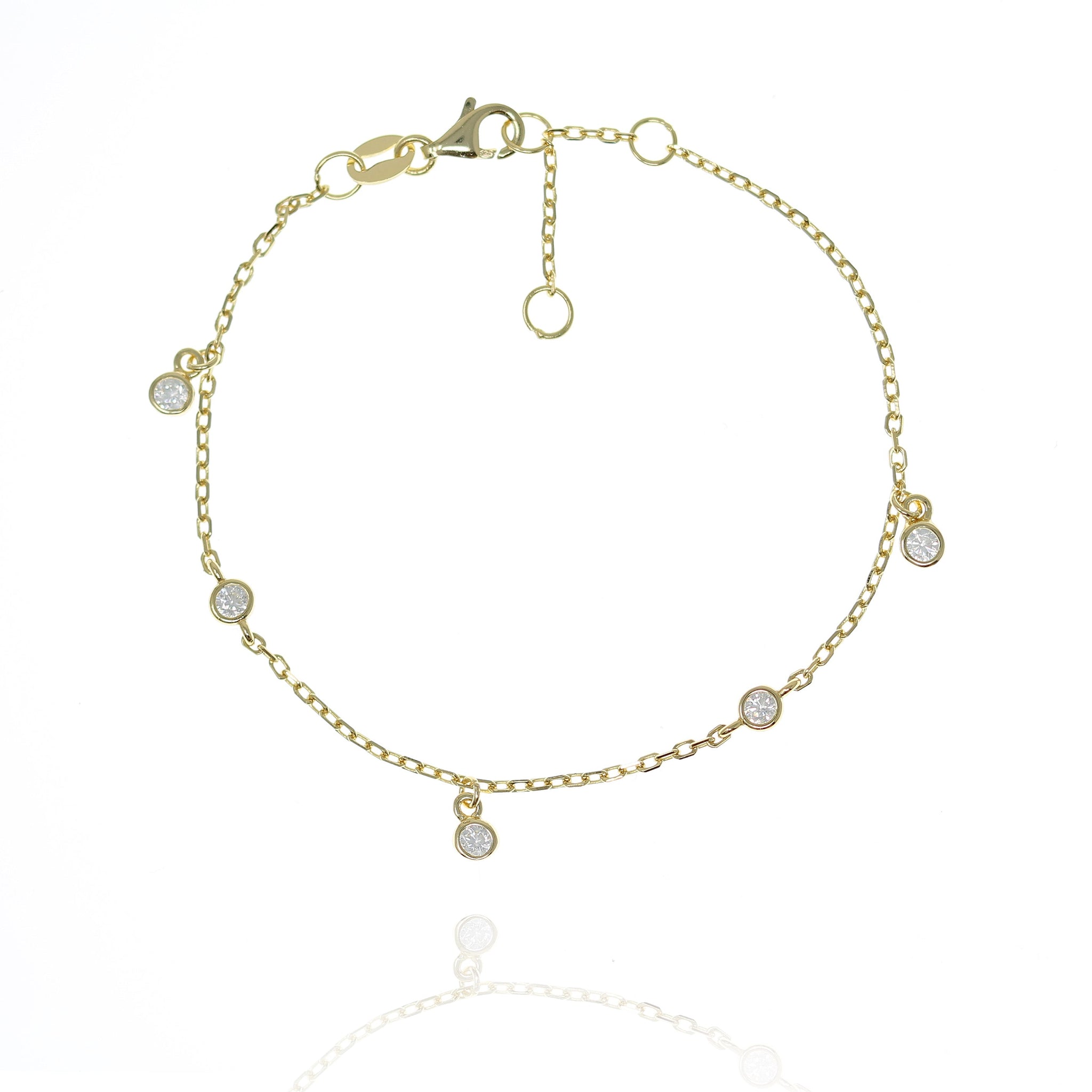 
Gold plated sterling silver chain bracelet with 2 flat bezel-set cubic zirconia and 3 hanging cubic zirconia gems.

