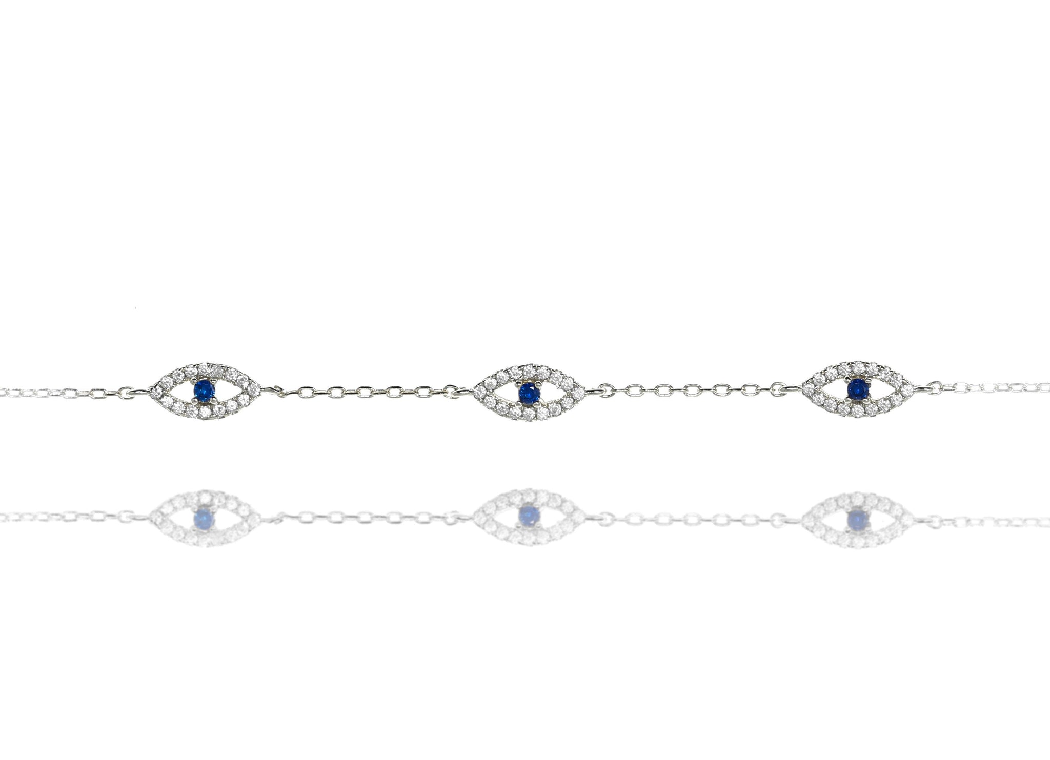 
Sterling silver chain bracelet with cubic zirconia evil eye design featuring blue centre stones.

