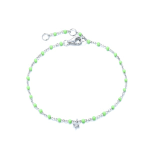 
Sterling silver chain with light green beads bracelet featuring a hanging cubic zirconia charm.

