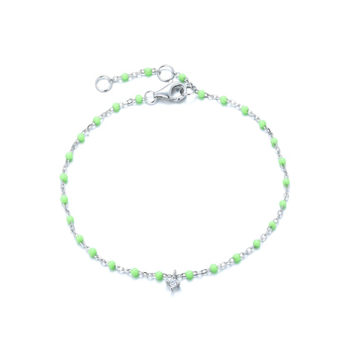 
Sterling silver chain with light green beads bracelet featuring a hanging cubic zirconia charm.

