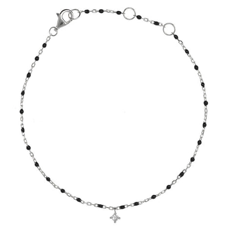 

Sterling silver chain bracelet with black beads and hanging CZ charm.

