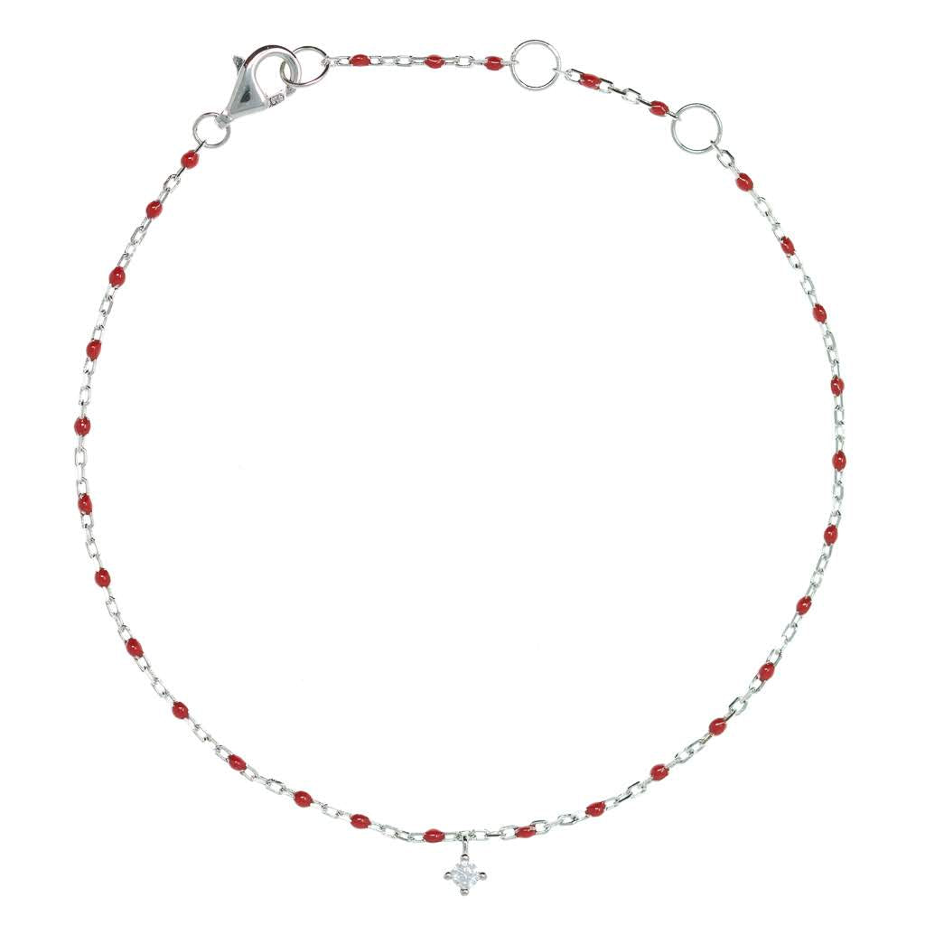 
Sterling silver chain bracelet with red beads and a hanging CZ charm.

