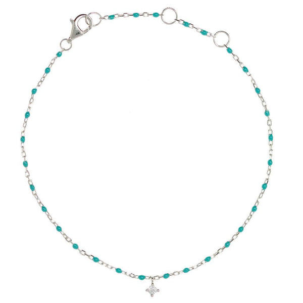 
Sterling silver chain bracelet with turquoise beads and a hanging CZ charm in the centre.

