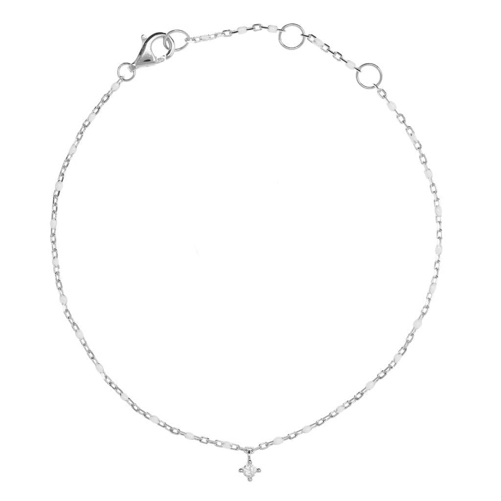 
Sterling silver chain bracelet with white beads and a hanging CZ charm.

