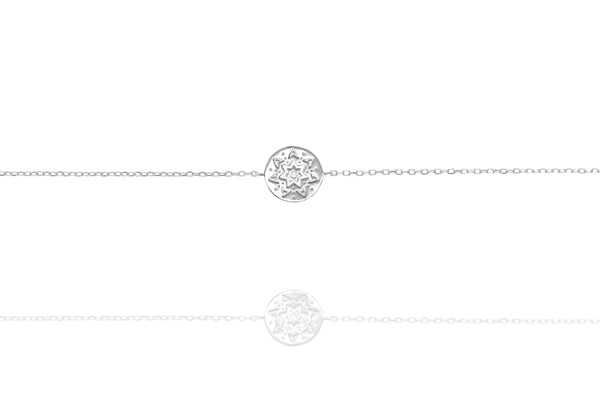 
Sterling silver chain bracelet with an embossed disk displayed  

