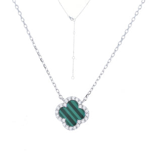 
Sterling Silver Malachite Clover Charm Necklace with white CZ rim on display.

