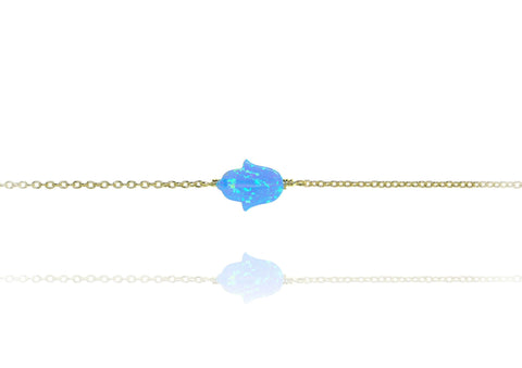 

Gold-plated silver chain bracelet with blue opal Hamsa charm  .

