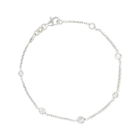 
A sterling silver chain bracelet with five small bezel set cubic zirconia and a lobster clasp.

