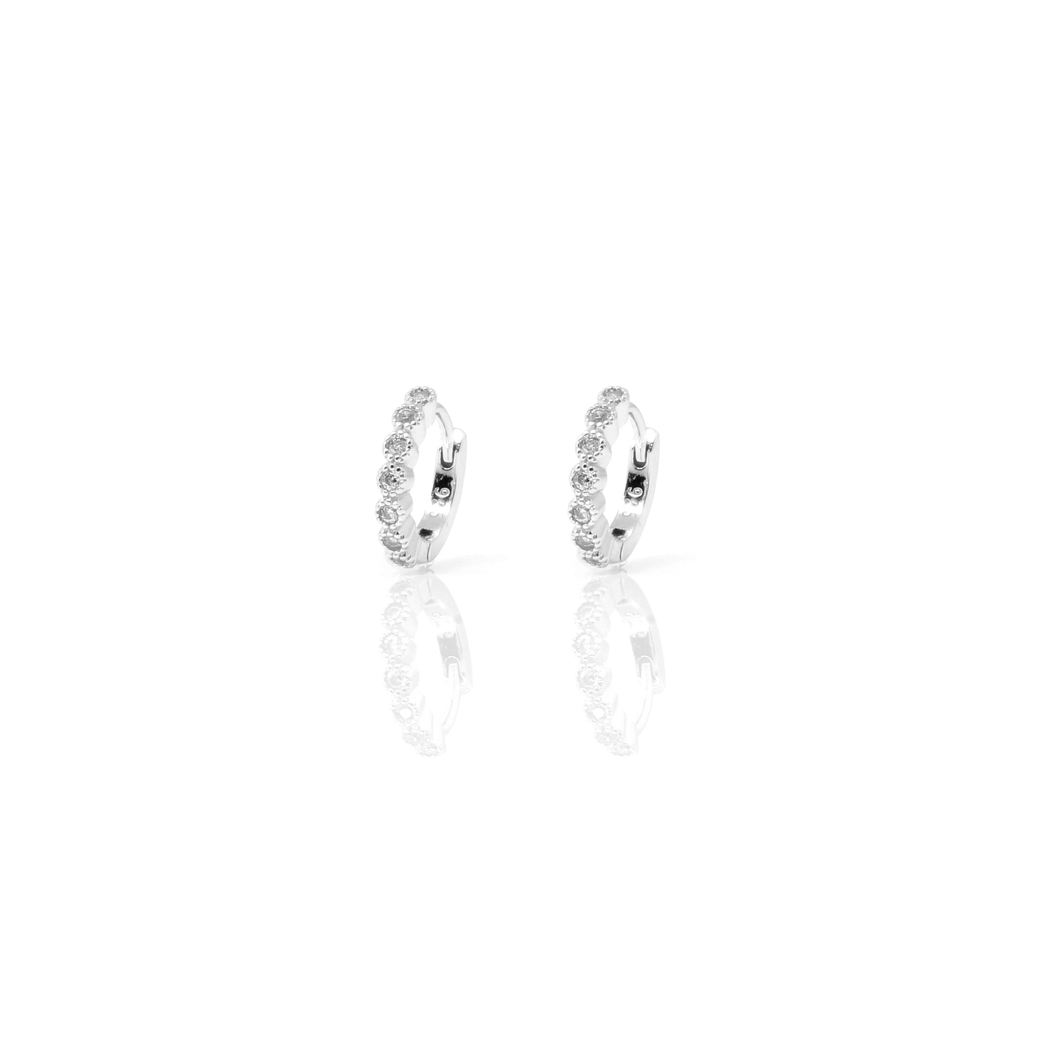 
Elegant sterling silver huggie earrings with sparkling cubic zirconia stones.

