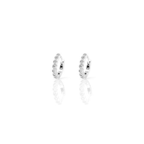 
Elegant sterling silver huggie earrings with sparkling cubic zirconia stones.

