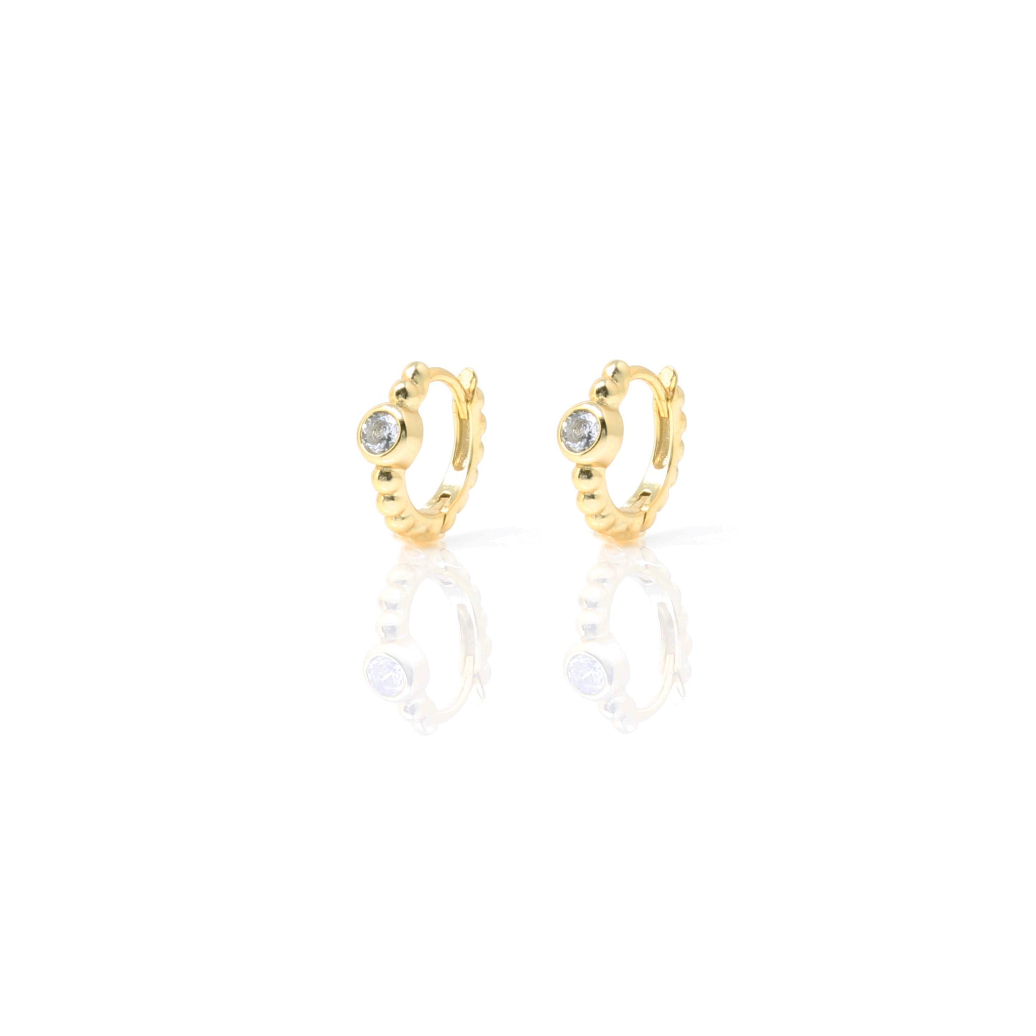 
Gold-plated silver huggie earrings with decorative gold hoops and cubic zirconia centre stones.

