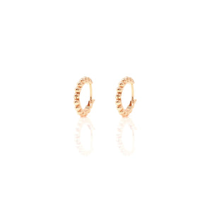 

Pair of rose gold plated huggie earrings with contoured hoop design  .

