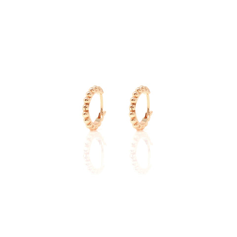 

Pair of rose gold plated huggie earrings with contoured hoop design  .

