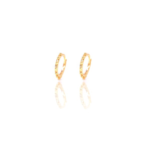 
A pair of gold-plated Huggies earrings with gold mounds, 10 mm in diameter.

