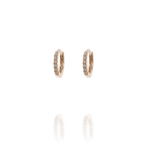 
Rose gold-plated silver ear huggies with cubic zirconia stones, 9mm in diameter.

