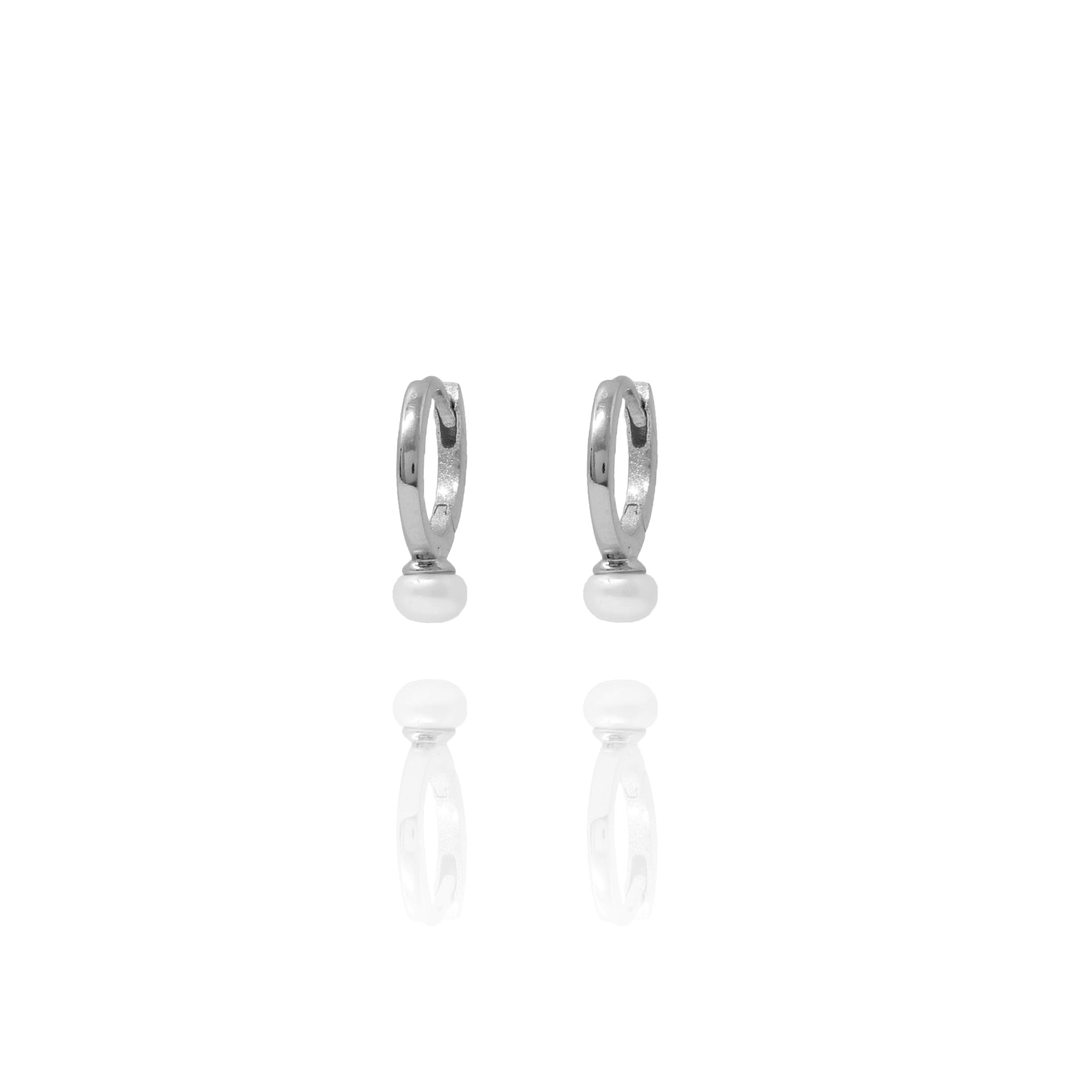 
Sterling silver huggie earrings with pearl accents, 12 mm diameter.

