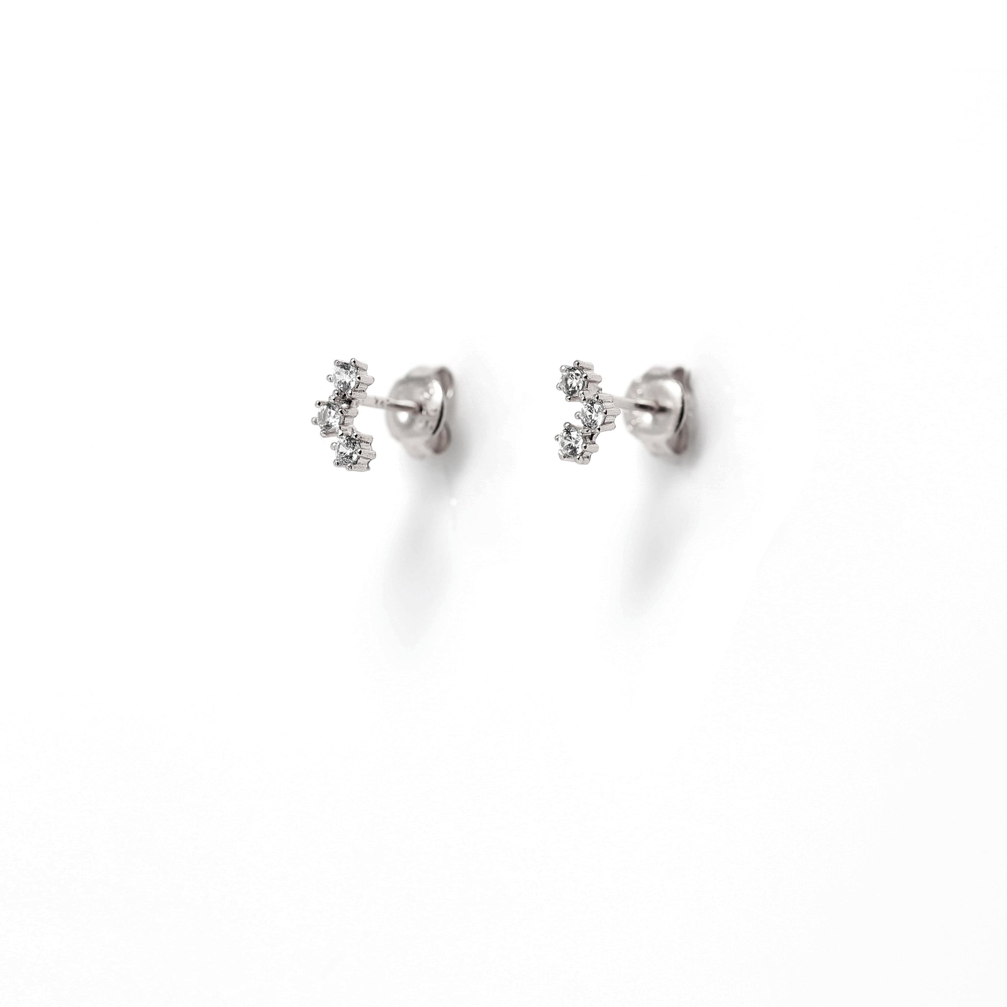 
Sterling silver stud earrings with a 3 cubic zirconia cluster, displayed  .

