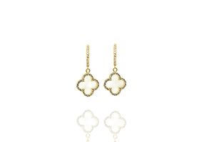 
Gold-plated silver earrings with hollow clover drops rimmed with white CZ stones on a reflective surface.

