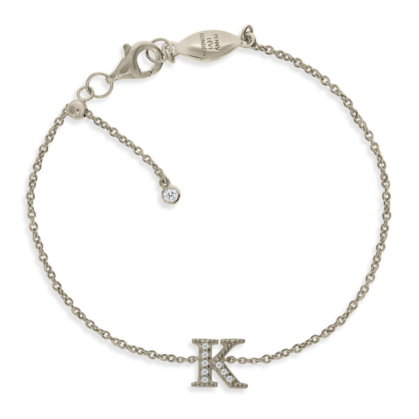 
Sterling silver chain bracelet featuring a cubic zirconia embellished initial 'K' with a sliding size adapter.

