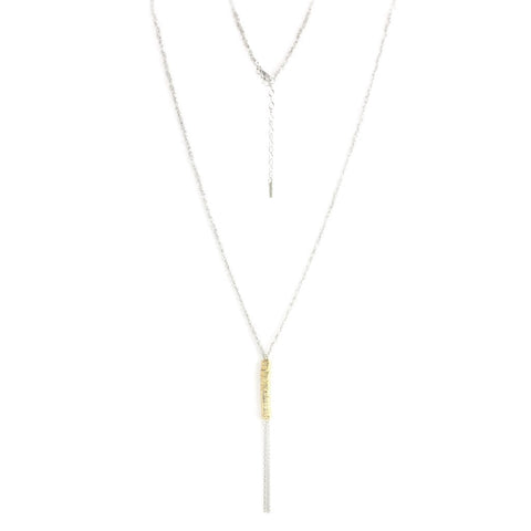 
Sterling silver knitted necklace with a gold-bound hanging chain tassel, displayed  .

