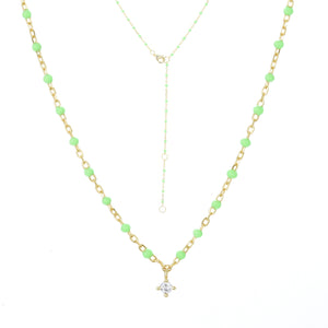 
Gold plated on silver chain necklace with apple green enamel beads and a hanging cubic zirconia pendant.

