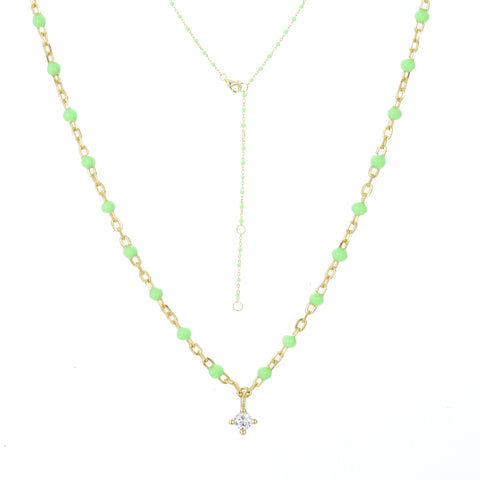 
Gold plated on silver chain necklace with apple green enamel beads and a hanging cubic zirconia pendant.

