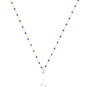 
Gold plated chain with blue beads and a small cubic zirconia pendant necklace

