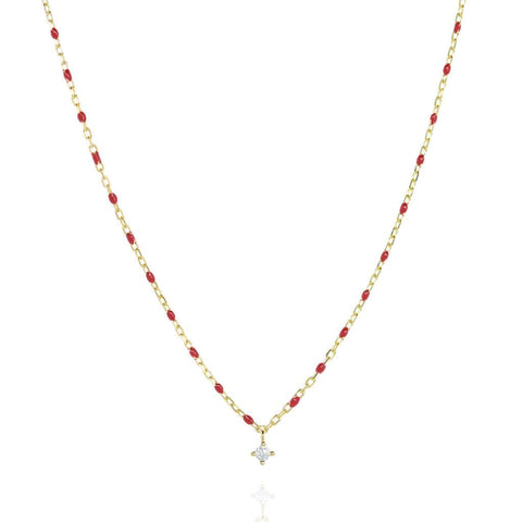 
Gold-plated necklace with red beads and a central Cubic Zirconia pendant.

