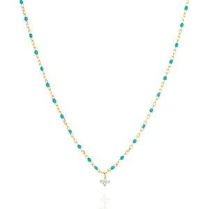 
Gold-plated short chain and turquoise bead necklace with a central Cubic Zirconia stone.

