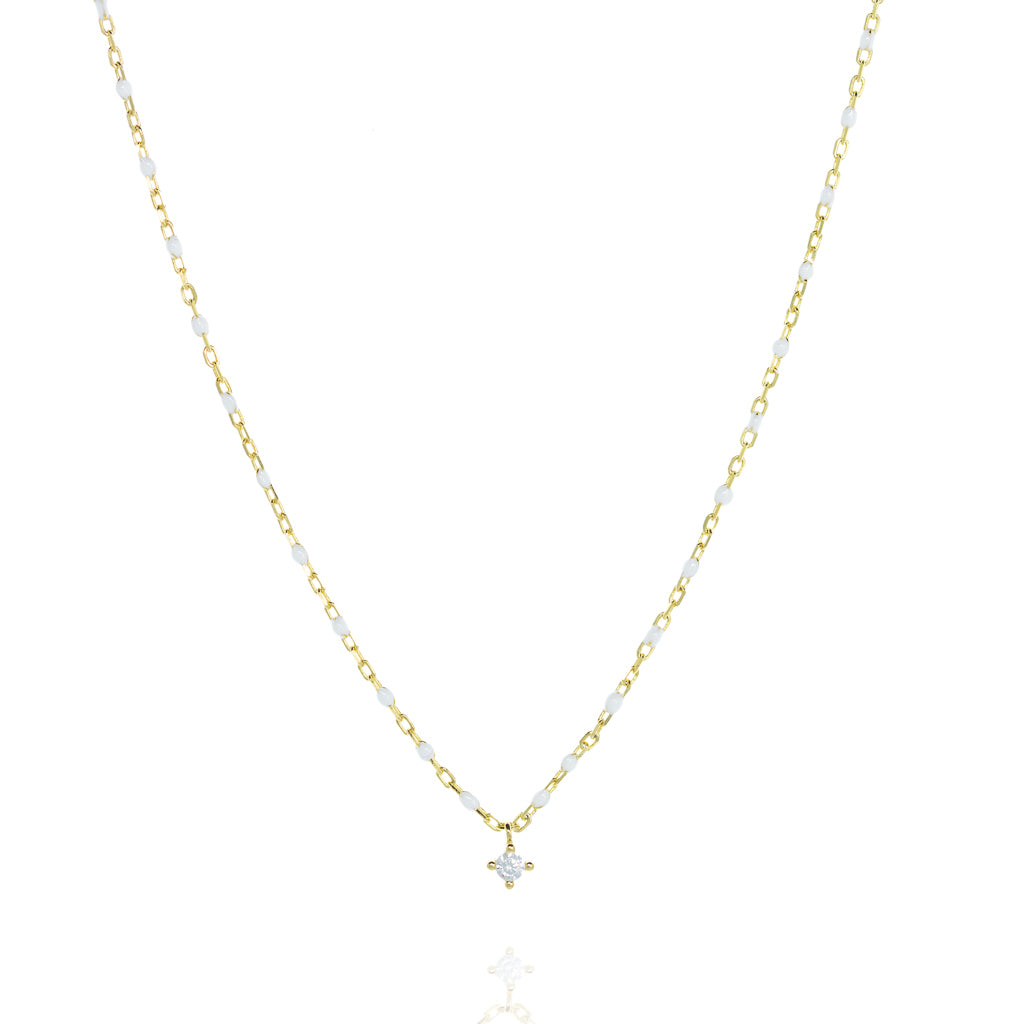 
Elegant gold plated silver chain necklace with white beads and a central small cubic zirconia.

