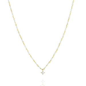 
Elegant gold plated silver chain necklace with white beads and a central small cubic zirconia.

