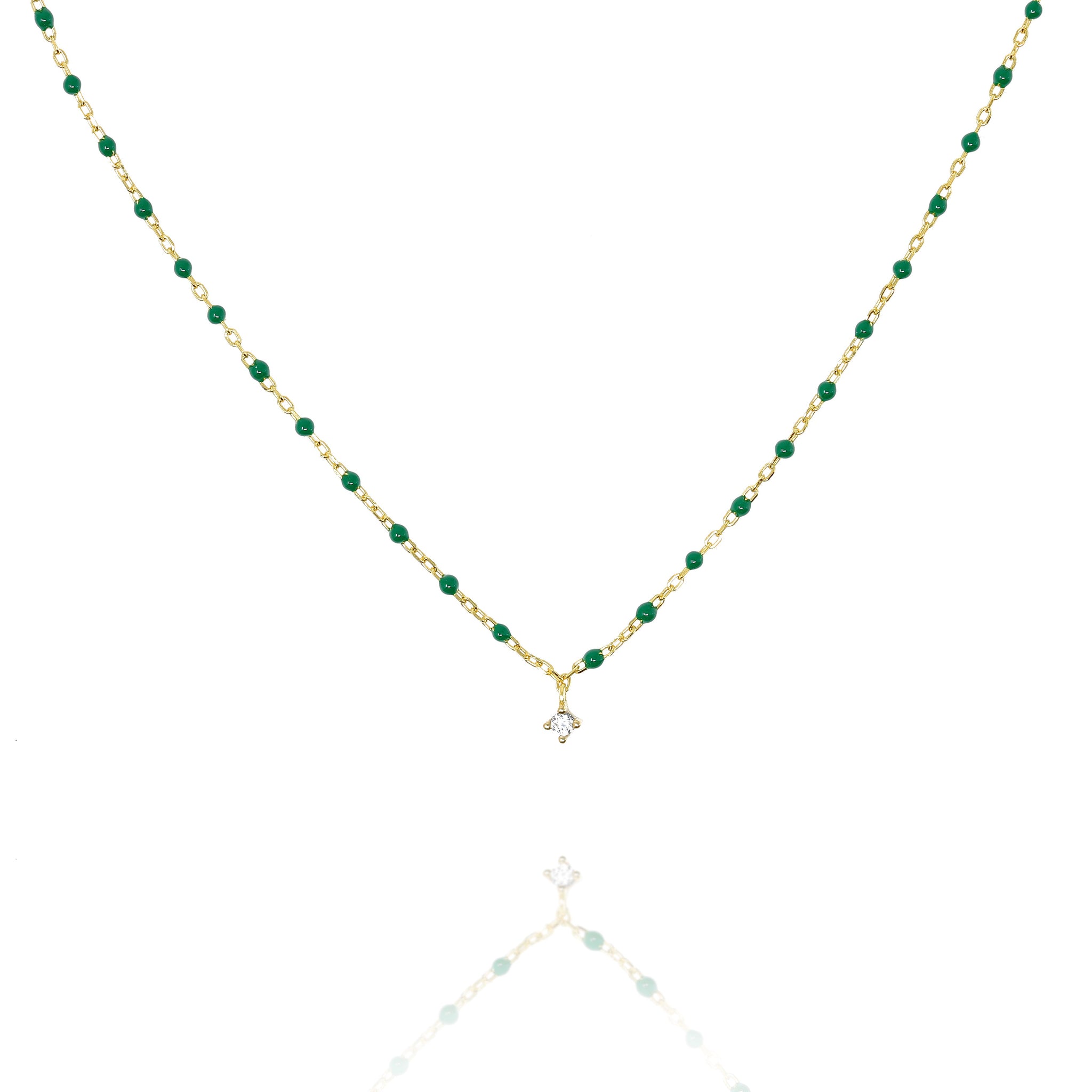 

Elegant short gold-plated necklace with green beads and a central Cubic Zirconia

