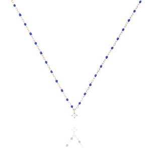 

Rose gold-plated silver necklace with blue beads and central cubic zirconia .

