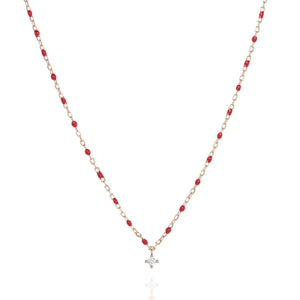 
Rose gold plated sterling silver short necklace with red beads and central Cubic Zirconia gem.

