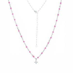 
Sterling silver chain and bead necklace with fuchsia coloured beads and a hanging cubic zirconia pendant.

