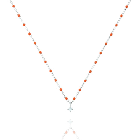 
Sterling silver orange bead necklace with a small cubic zirconia charm in the centre  .

