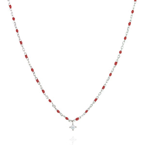 
Sterling silver short chain necklace with red beads and a central small Cubic Zirconia.

