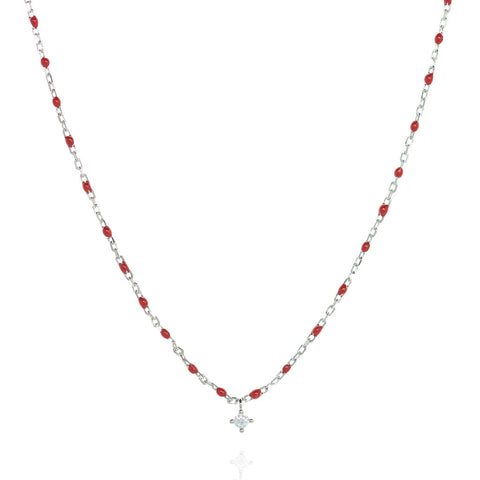 
Sterling silver short chain necklace with red beads and a central small Cubic Zirconia.

