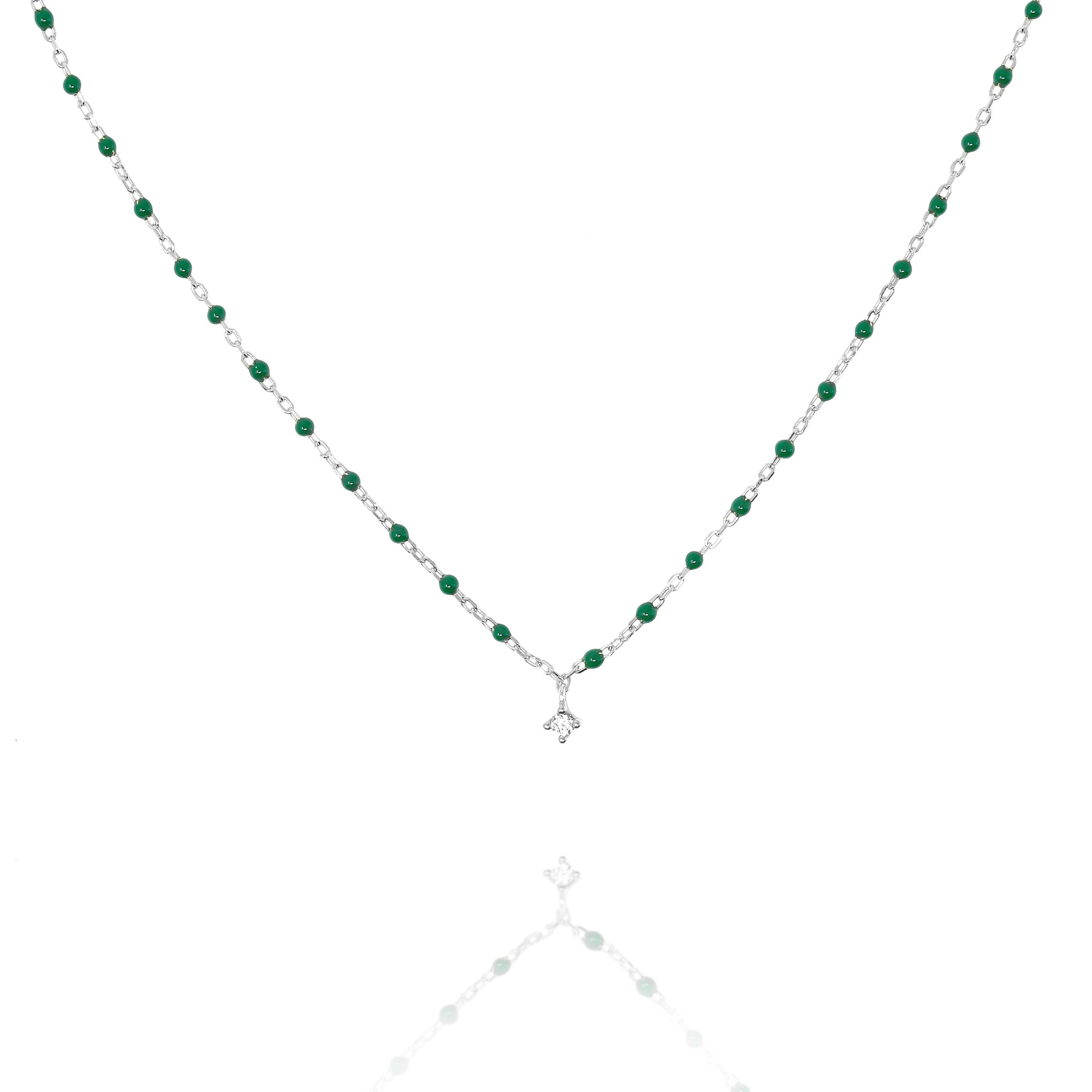 

Short Sterling silver chain and bead necklace with green beads and a central Cubic Zirconia, 45cm length including extensions.

