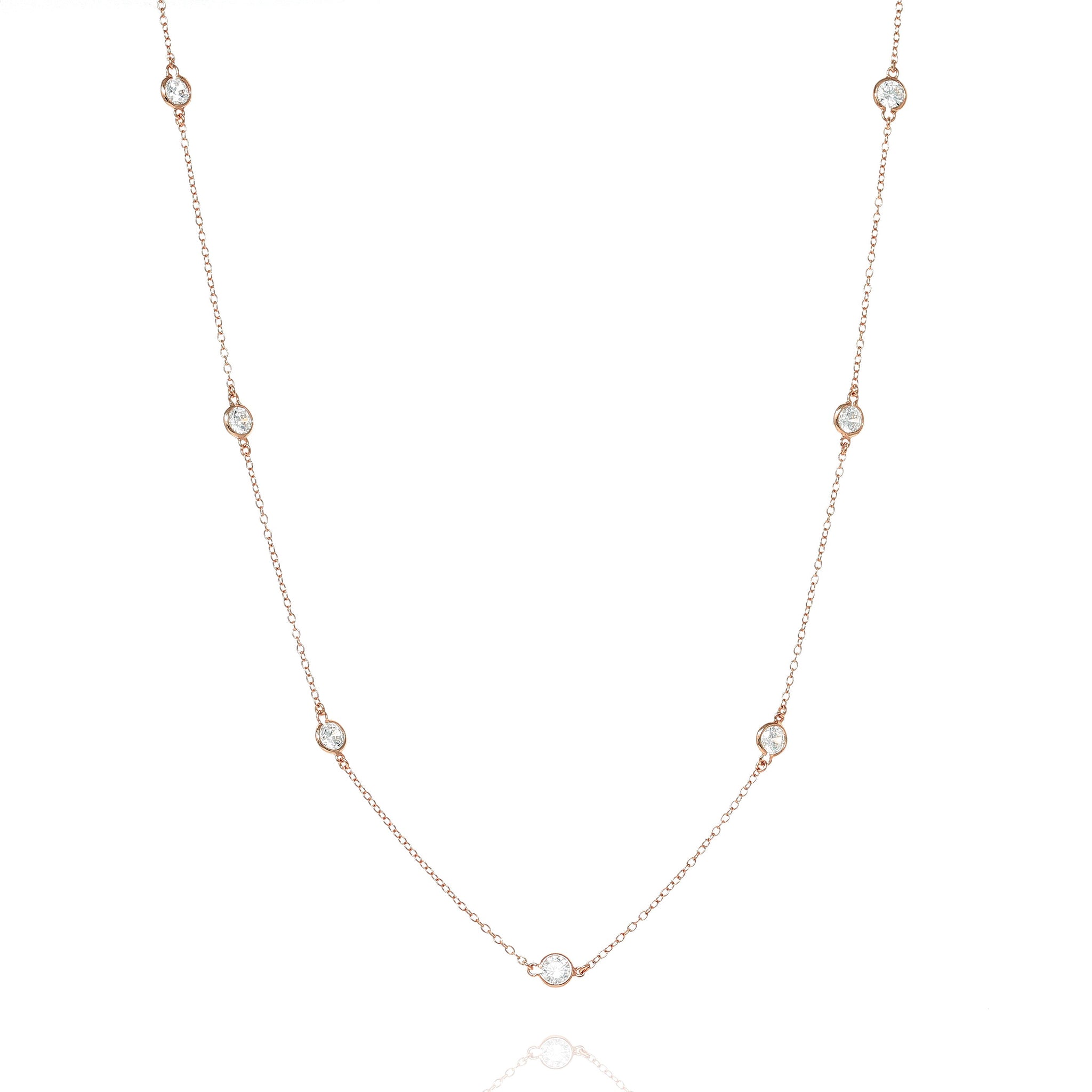 
A stunning rose gold-plated necklace made of sterling silver with bezel-cut cubic zirconia, featuring a delicate chain design. 

