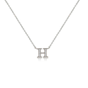 
Sterling silver initial necklace with cubic zirconia decoration on an adjustable chain.

