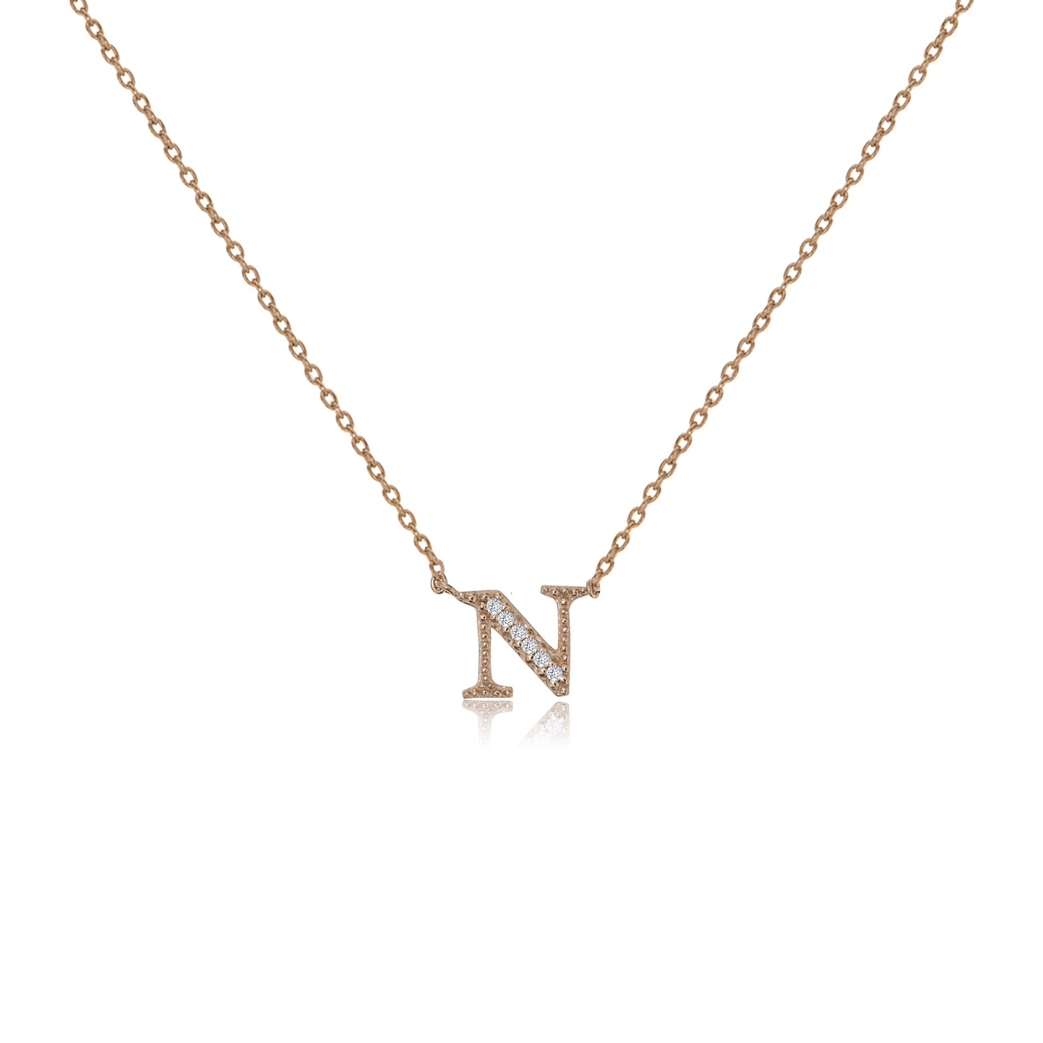 
Rose gold plated initial 'N' necklace with cubic zirconia decoration  .

