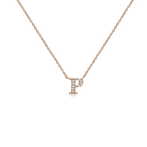 
A rose gold on silver initial necklace with cubic zirconia stones and a sliding length adjuster.

