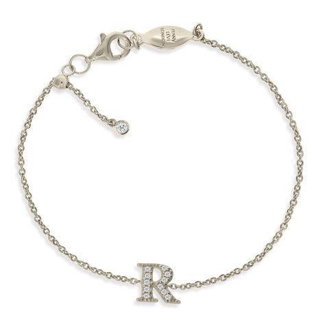 
Sterling silver chain initial bracelet with a cubic zirconia 'R' charm and a sliding size adapter.

