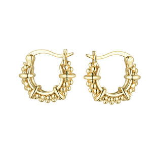 
Close-up of gold-plated on silver beaded hoop earrings with a structured design and chain attachment.

